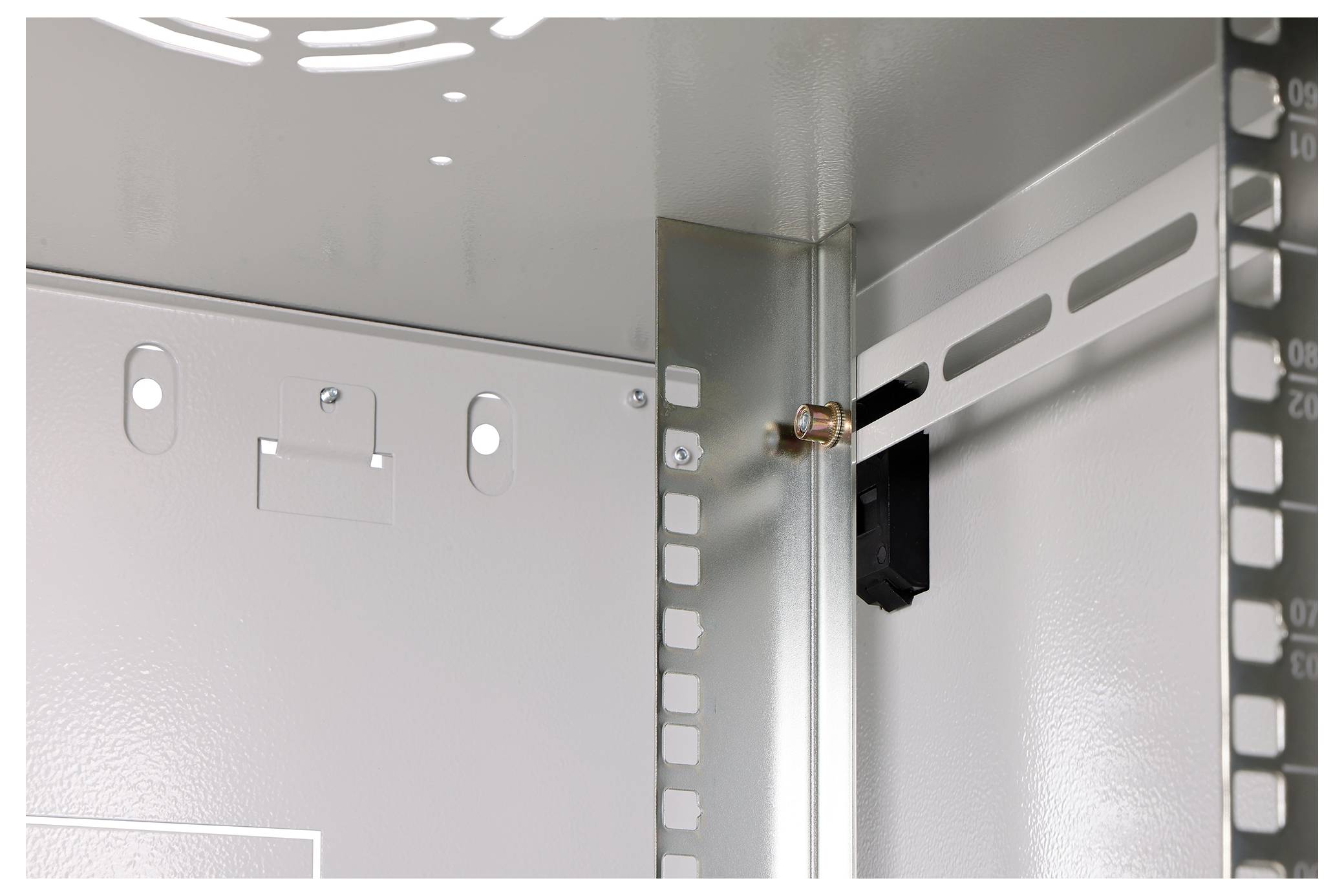 Interior of a metal electrical enclosure showing mounting brackets and grounding connections.