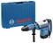 A blue Bosch hammer drill with a black handle and a blue carrying case marked with the Bosch logo, designed for professional use.