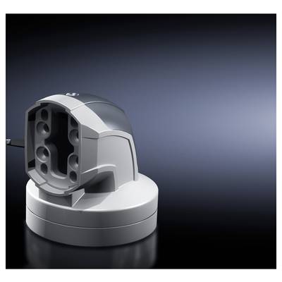 A grey charger without a device inserted, standing on a dark surface, illuminated against a navy blue background.