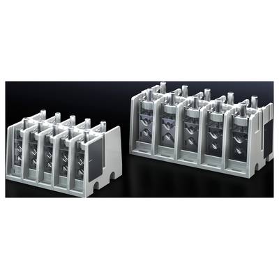 'Two grey, block-shaped metal components with multiple vertical elements lying side by side on a dark surface.'