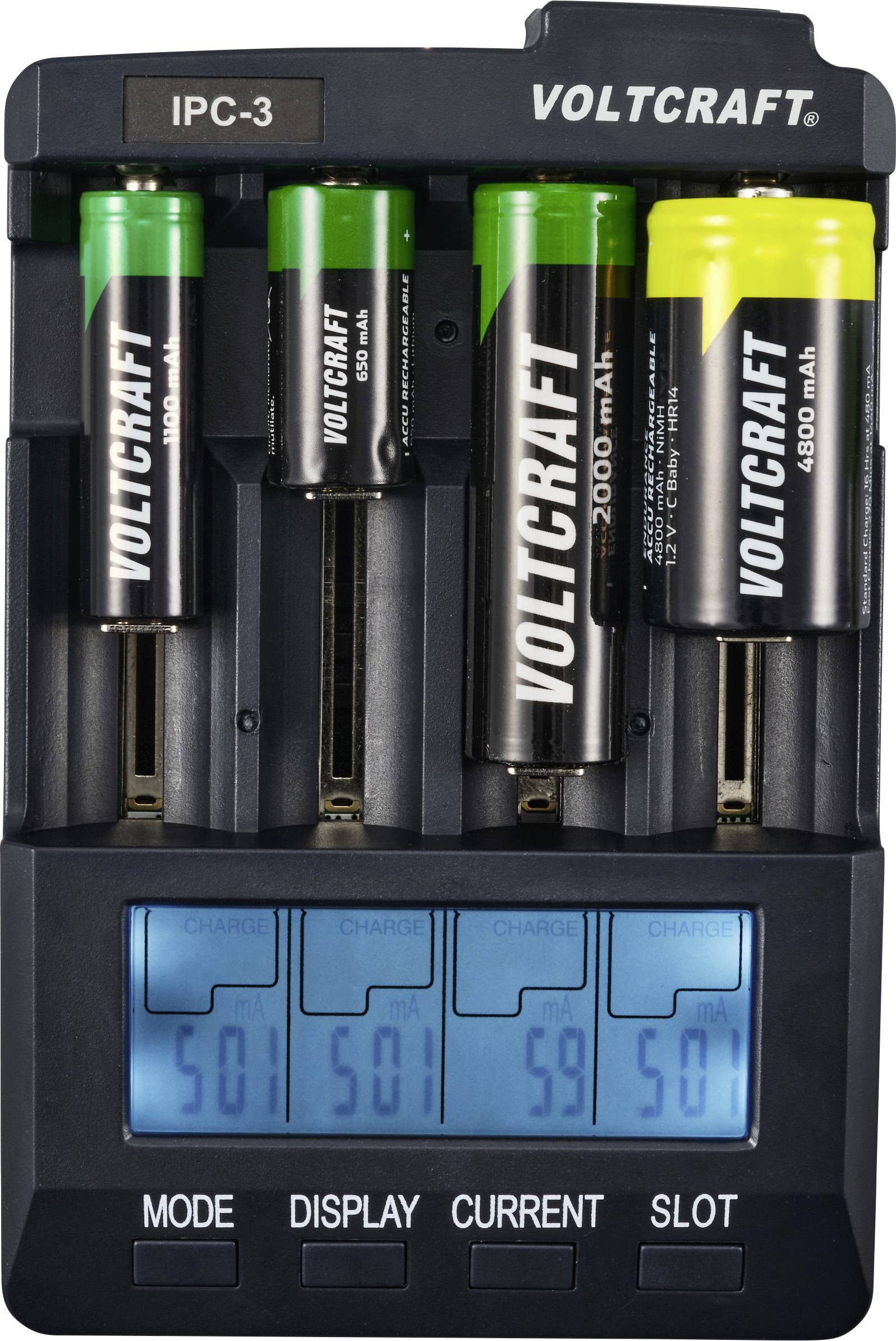 'VOLTCRAFT IPC-3' battery charger with four batteries. Digital display shows charging voltage for each battery.