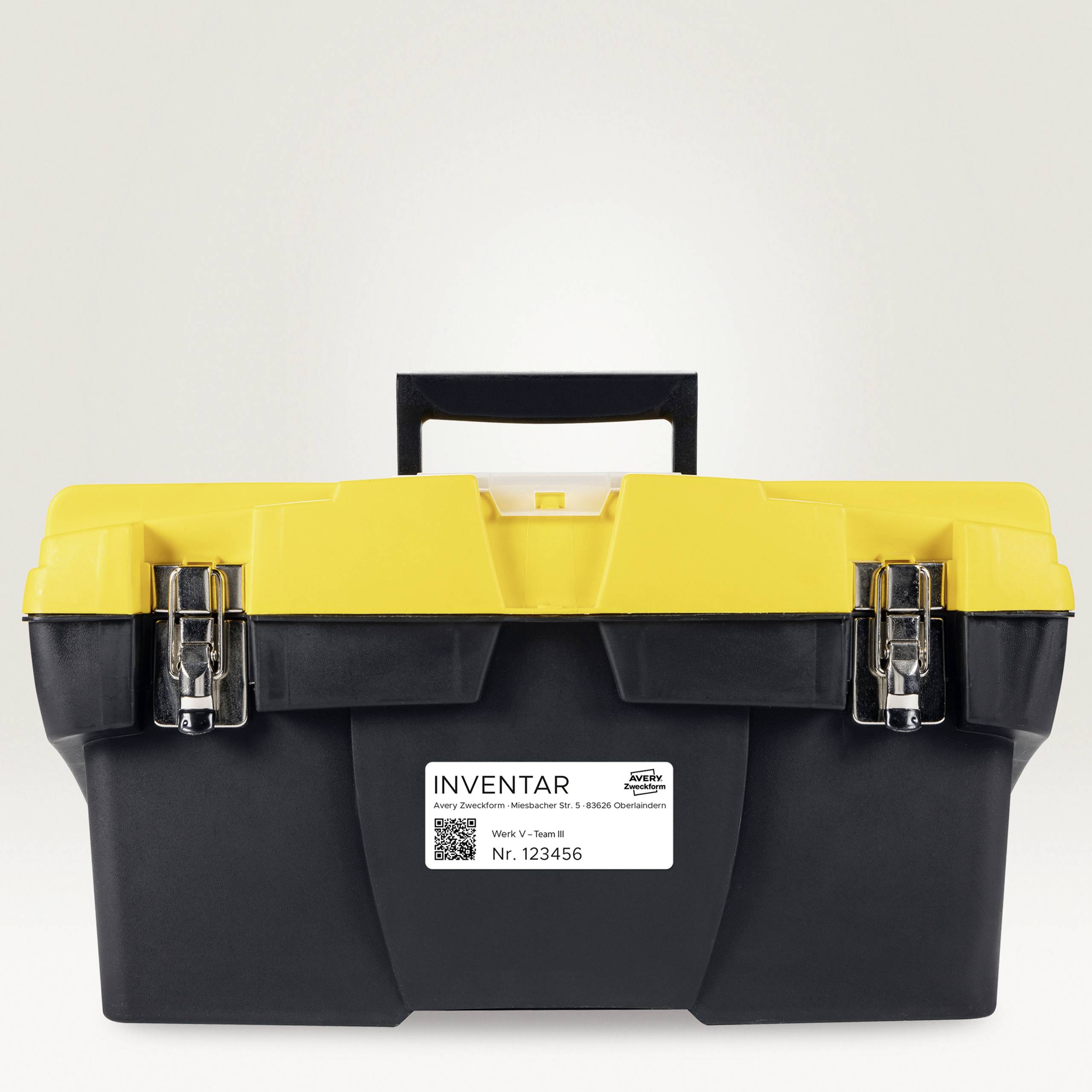 Black toolbox with yellow lid and carry handle; label with 'INVENTORY' inscription and serial number visible.