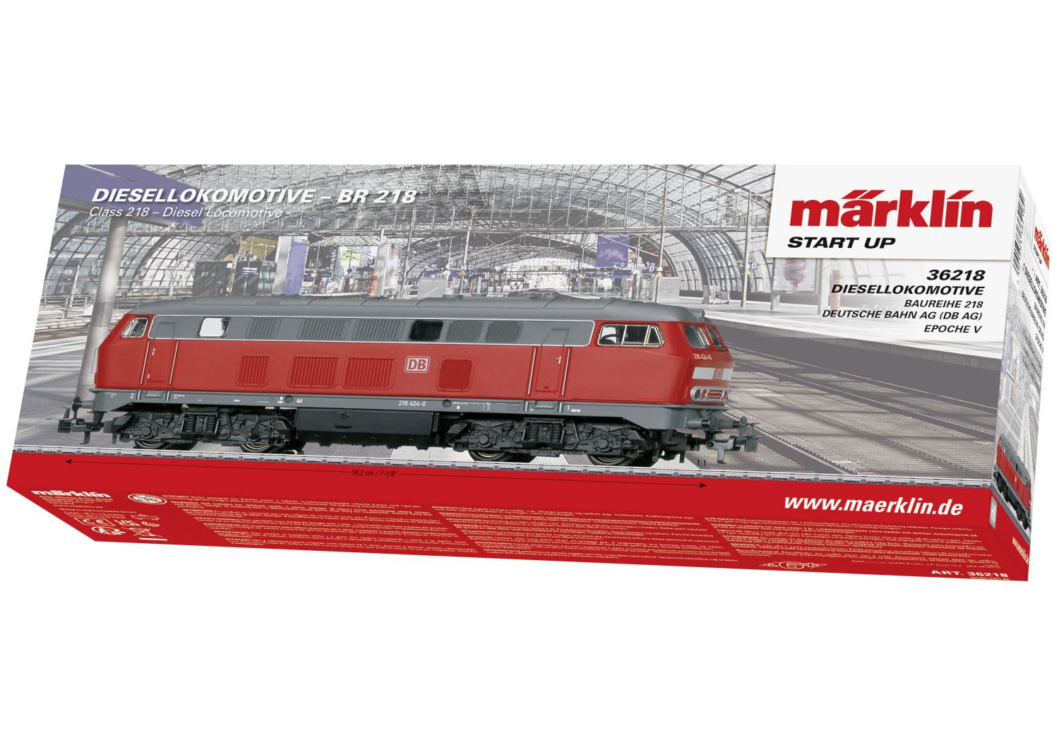 Packaging of a Märklin "Start Up" set featuring a red DB Class 218 diesel locomotive against a railway station background.
