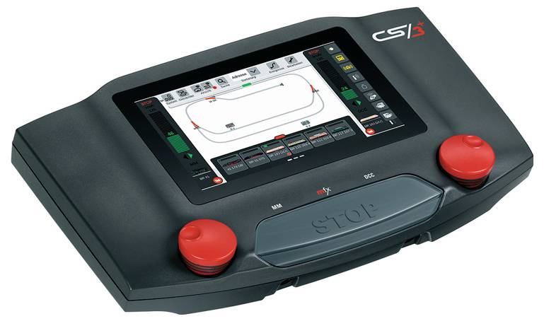 Portable control unit with a touchscreen and two red emergency stop buttons. The display shows a technical user interface.