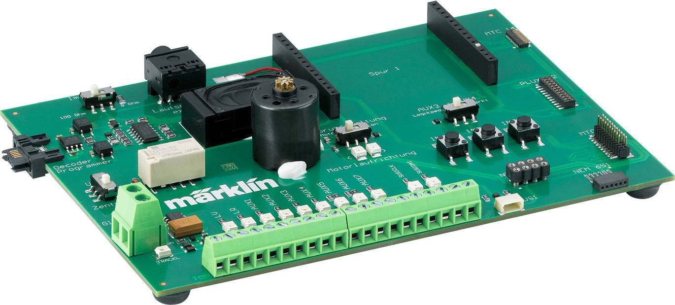 Electronic circuit board with various components, including switches, connectors and motor, bearing the 'Märklin' imprint.