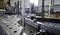 A man in a workshop is working at a metal workstation with tools and equipment; industrial environment; focus on metal table.