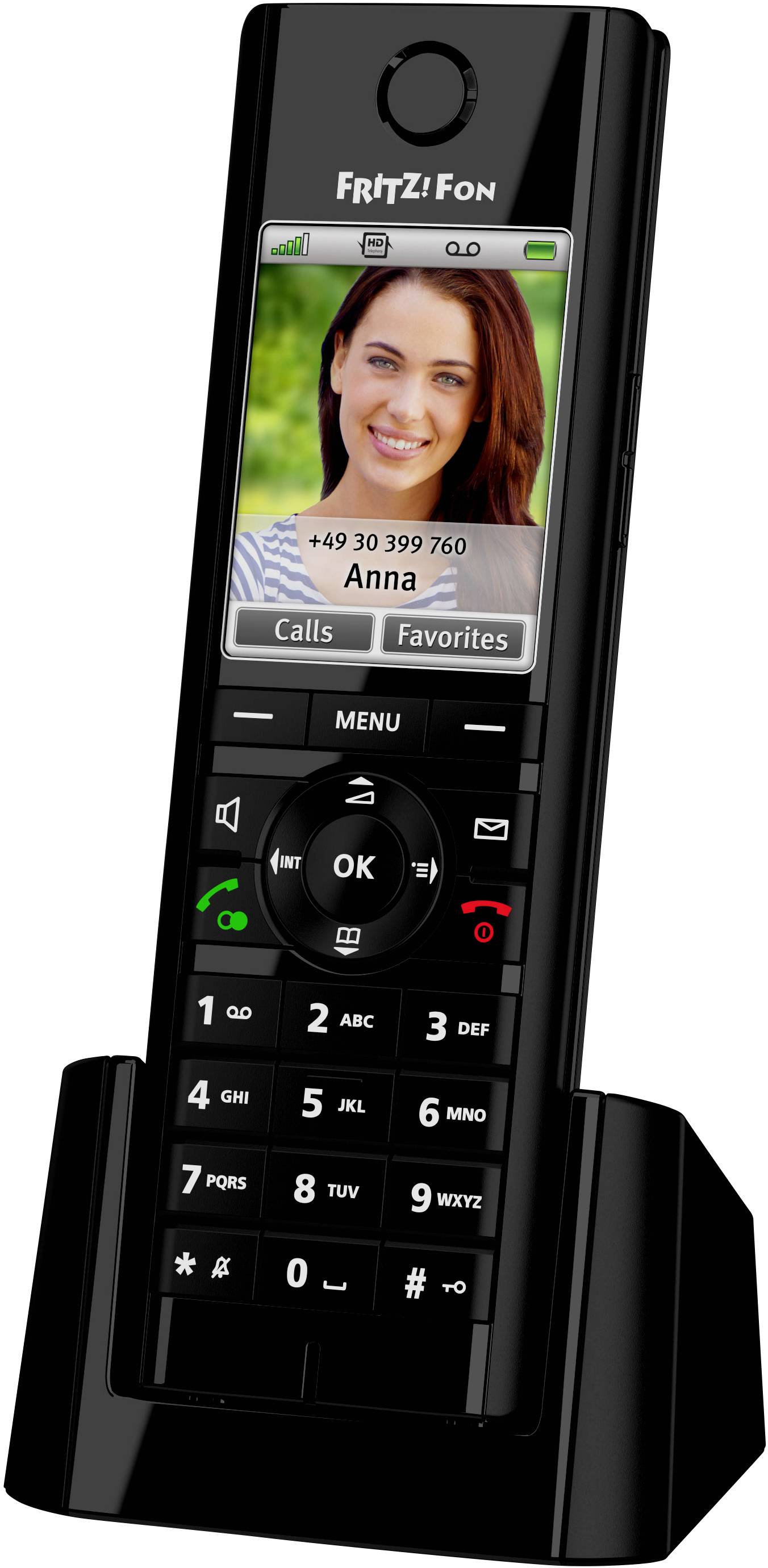 A cordless DECT phone on a charging station. The display shows a photo of a person with the telephone number and name 'Anna'.