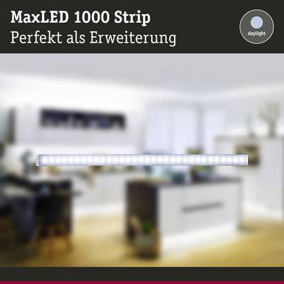 'MaxLED 1000 Strip - Perfect as an Extension' LED strip in a contemporary living room, softly illuminated. 'Daylight' brand logo in top right corner.