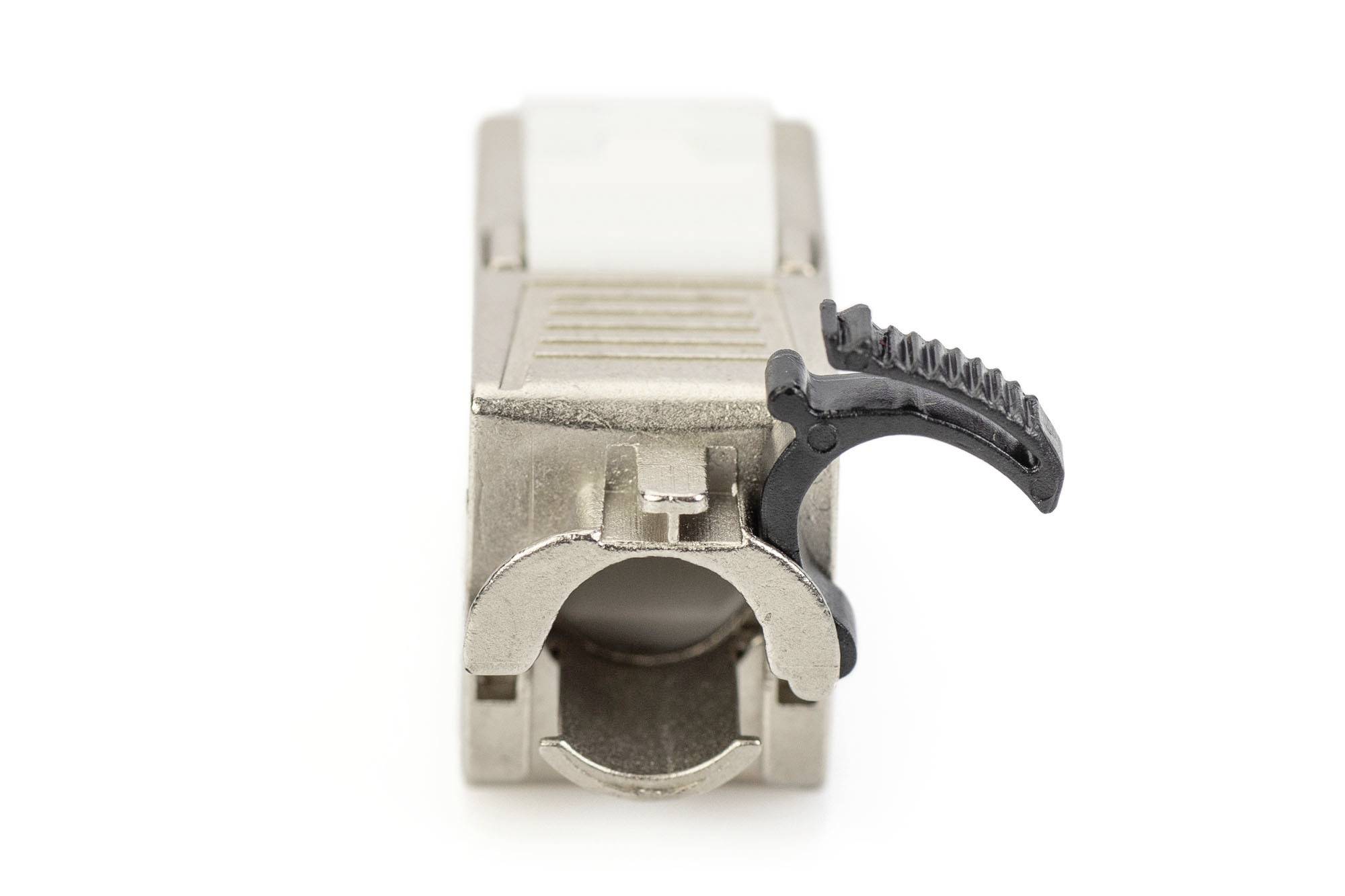 A silver plug with a black lever, isolated on a white background. The plug is rectangular and facing forwards.
