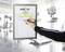 A person is writing with a pen on a form titled 'ACTIFIT Cardio Training' in a fitness centre.