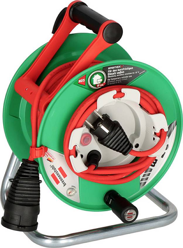 'Green cable drum with red handle and black plug, standing on a metal stand. Suitable for outdoor use.'