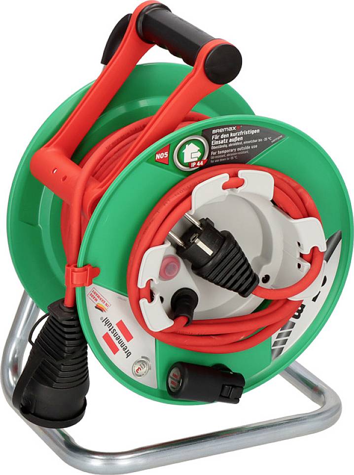 Green cable reel with red handle, extendable orange cable and black plug. 'Cable reel' label on the item.