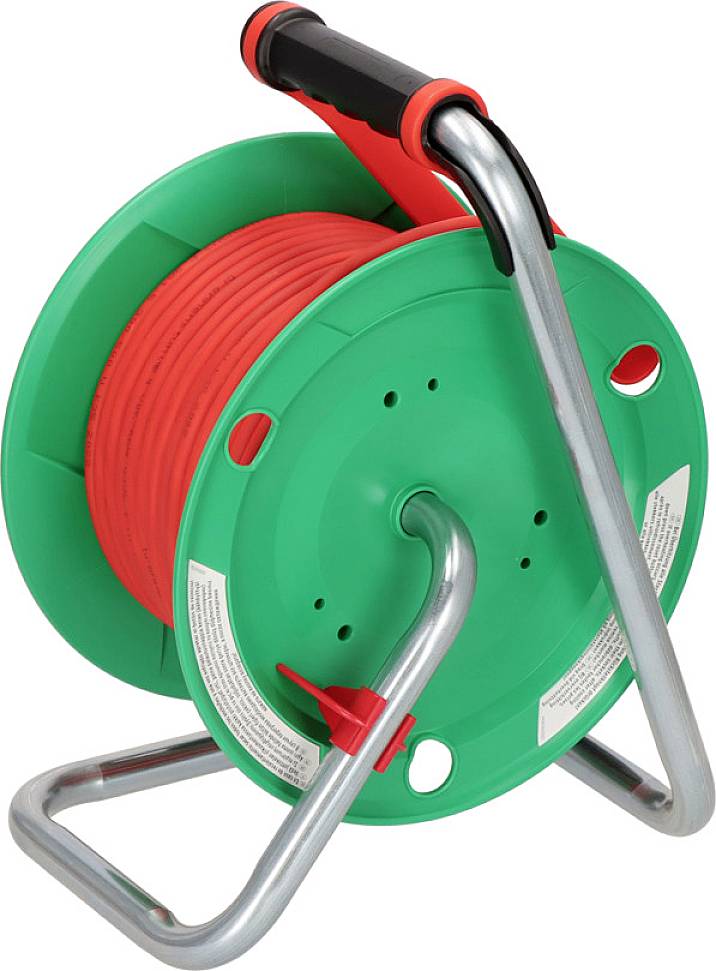 A green and red extension lead on a cable reel with a metal stand and black handle.