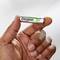 A hand is holding a rechargeable AAA battery from the brand 'Energizer'. The battery is marked with a positive plus sign.