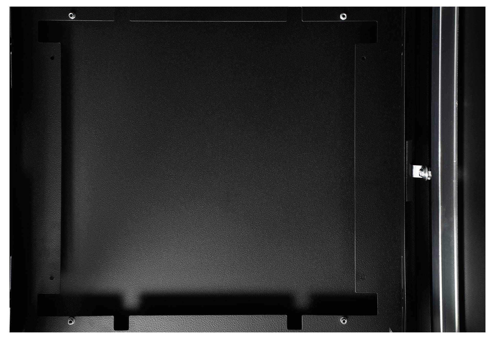 A blank, square, black frame with screw holes at the corners. Background dark, no discernible motif.