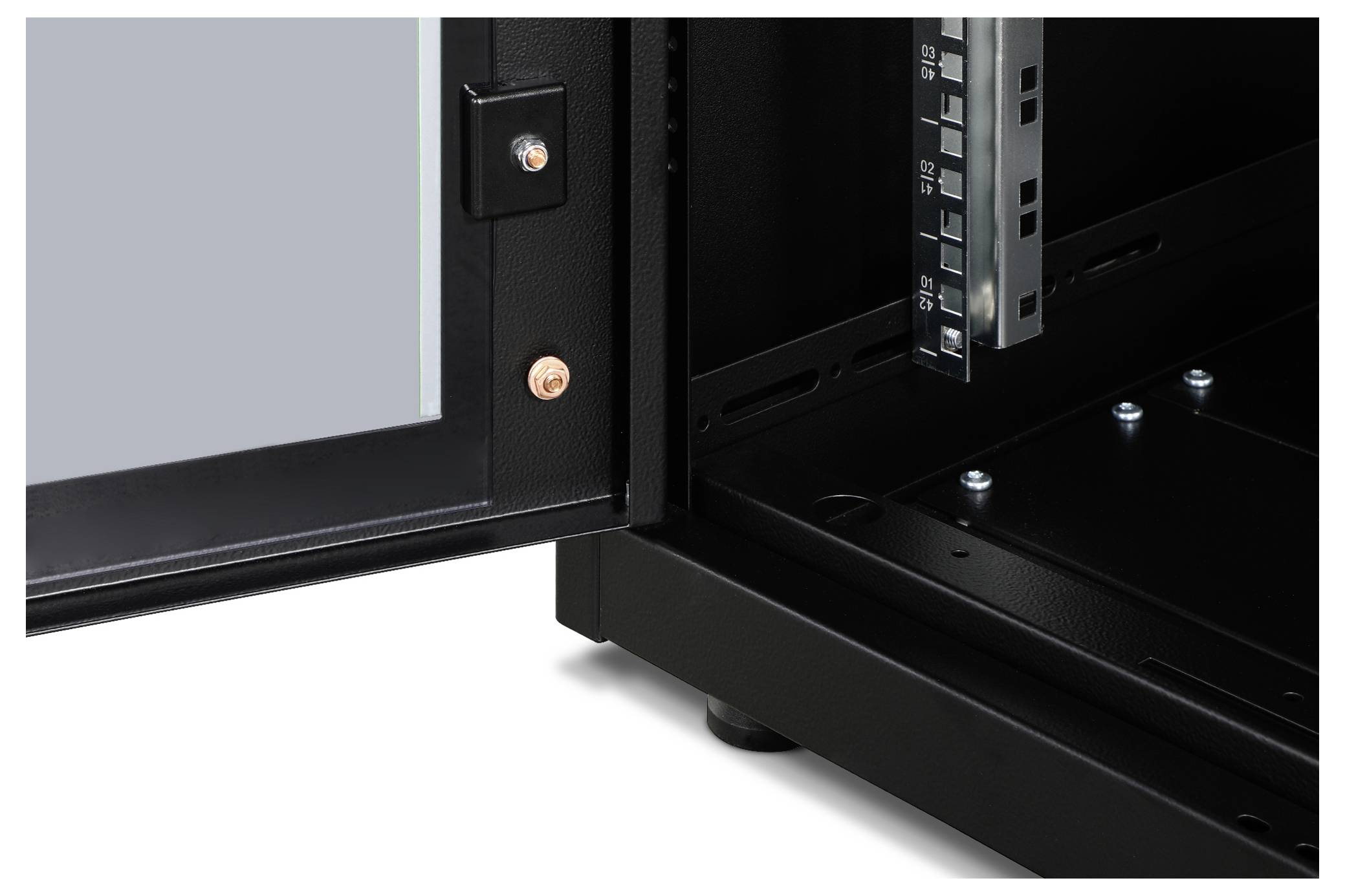 Inside a metallic enclosure, there is an open cupboard facing the inner side wall and a door with a glass panel.