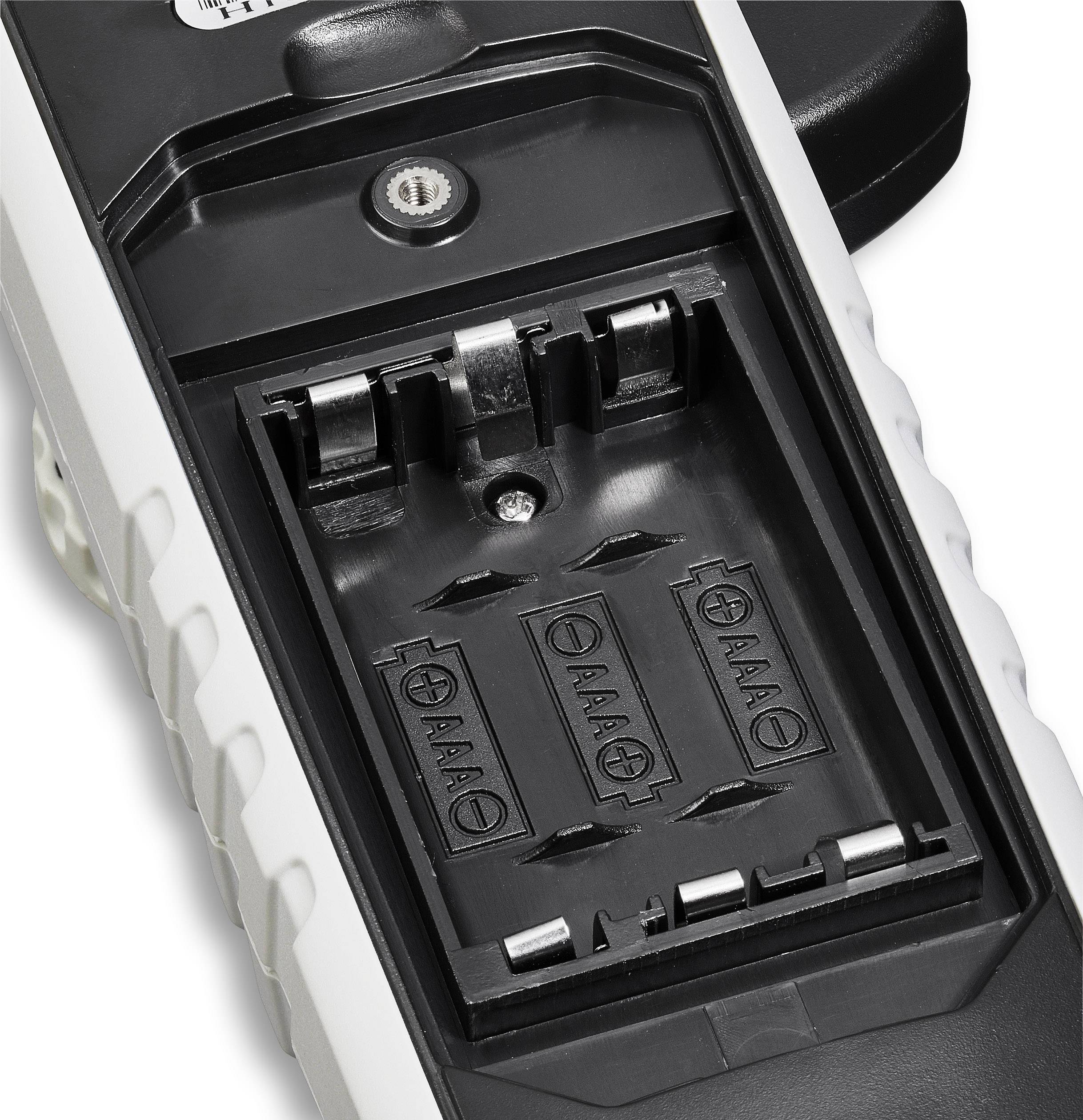 An open battery compartment for two AAA batteries, without batteries inserted.