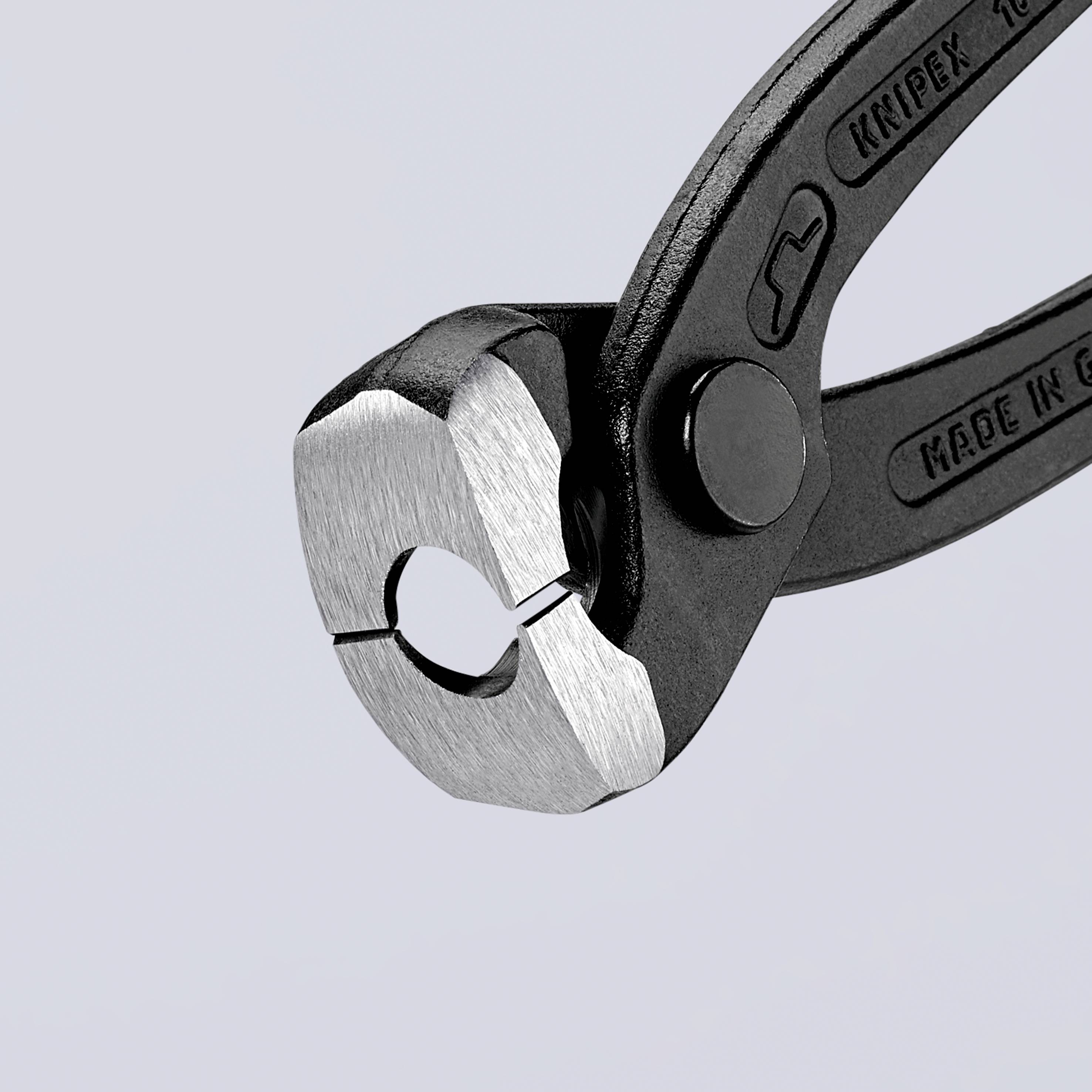 Pliers with a grey head and black handle, with brand name and 'Made in Germany' embossing visible, lying on a grey background.