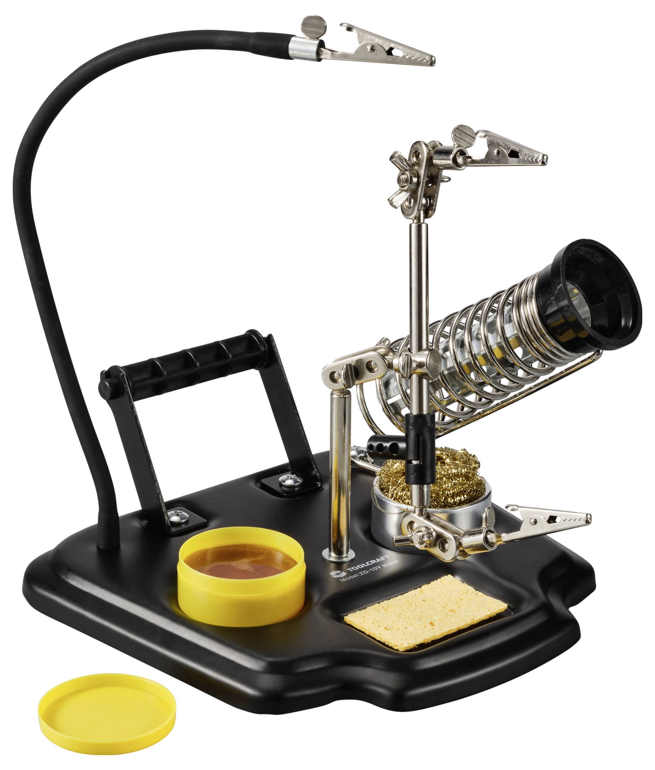 Soldering iron stand with magnifying glass, crocodile clips, and cleaning sponge, ideal for securely holding and working on electronic components.
