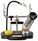 Soldering iron stand with holders, magnifying glass and cleaning sponge; ideal for precise electronic work.