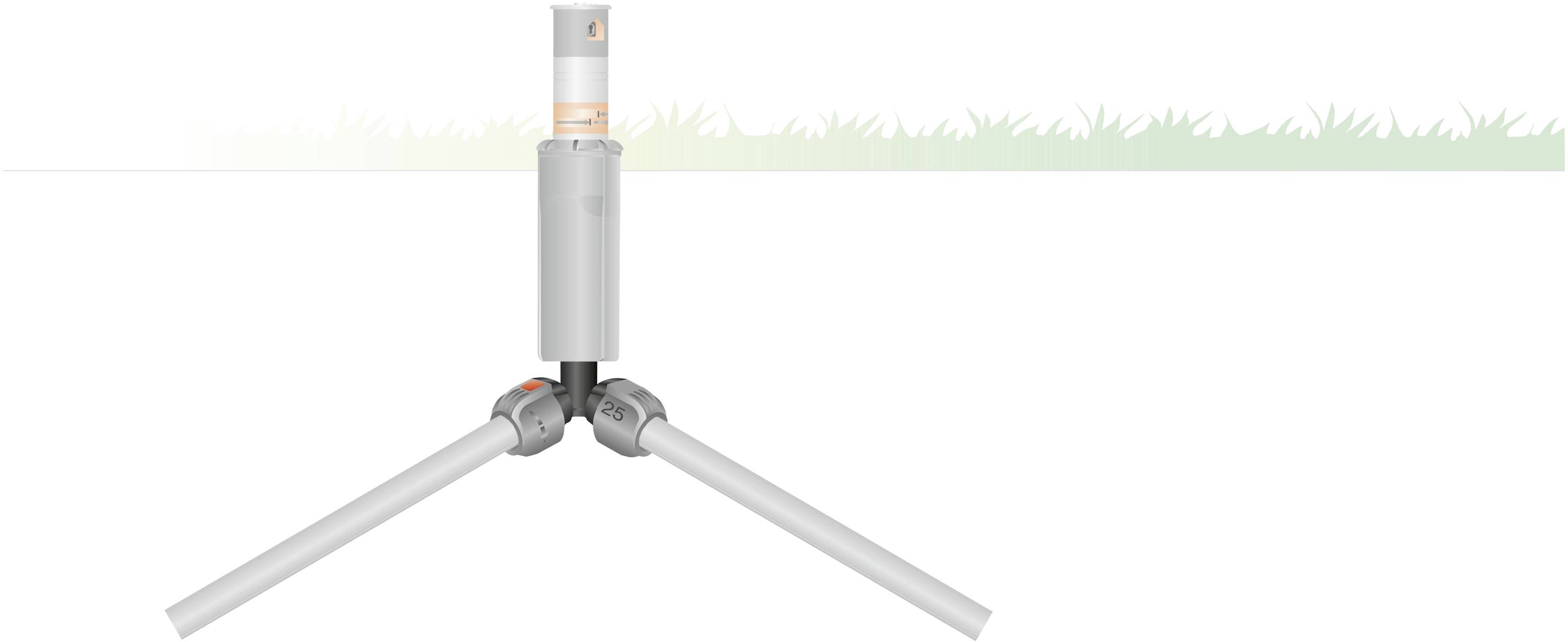 A silver garden sprinkler with three folding legs in an extended position stands on a white surface with a green grass line in the background.