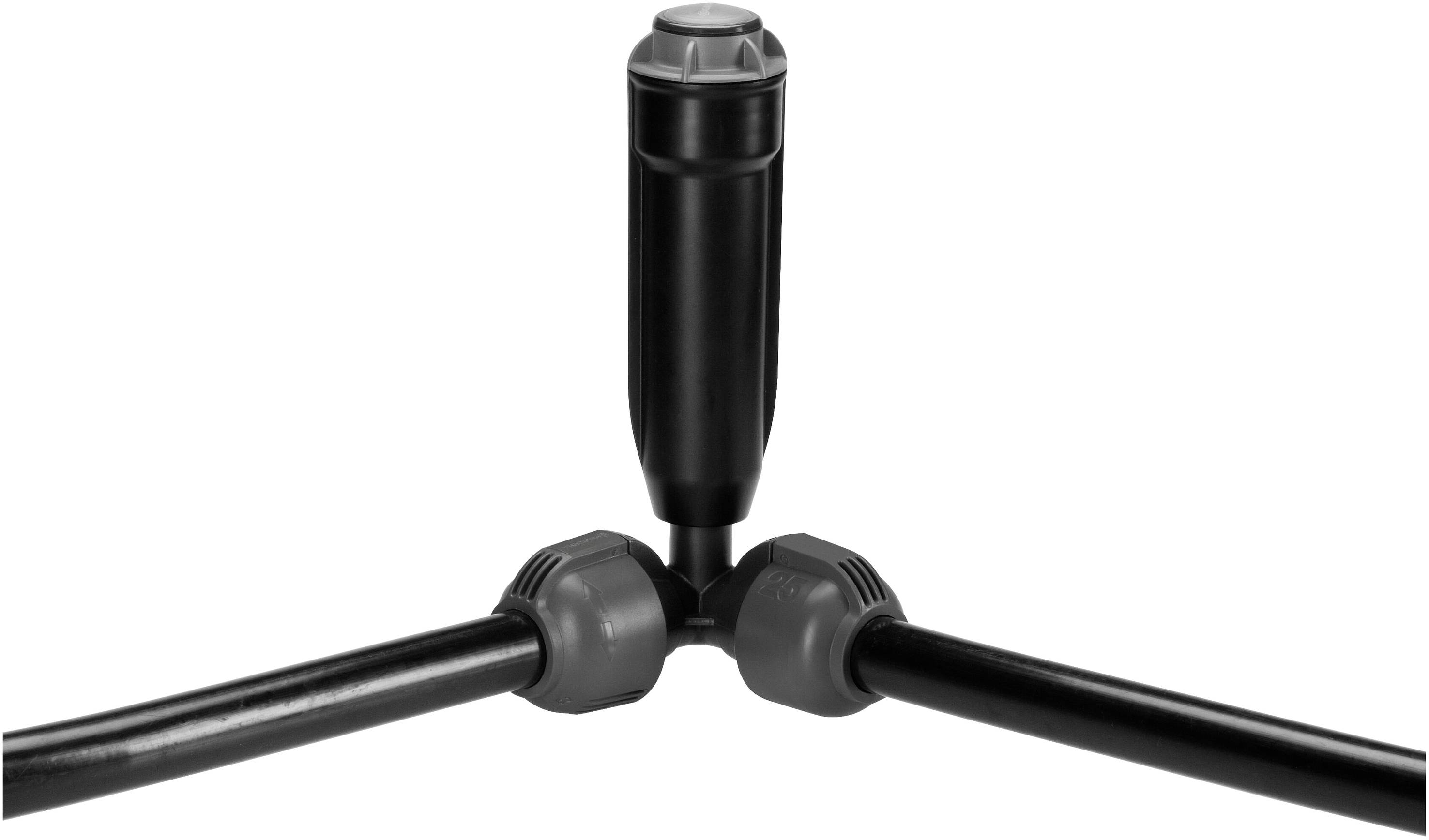 'Black plastic T-piece with a black sprinkler-like component in the middle, connected to two black pipes.'