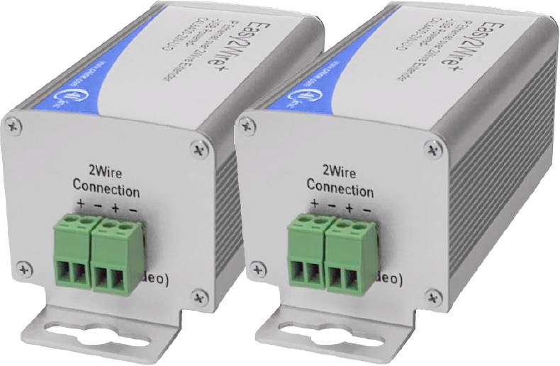 Two metal devices with the inscription '2Wire Connection' and green connection terminals. They are similarly designed and are likely used for wiring or data transmission.