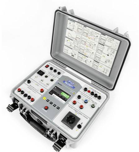 The image shows an electronic testing device in an open case with various control elements and a display presenting technical diagrams.