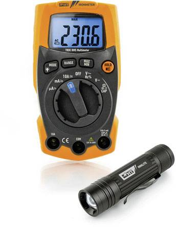 A digital multimeter with an orange casing displays '230.6'. A small black torch lies beside it.