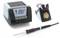 'Soldering station with digital display showing 350°C, soldering pencil, and cleaning sponge. Used for precision electronics work.'