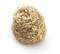 A golden metallic scrubber coiled into a tight ball, used for cleaning surfaces.