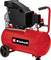 Red Einhell portable air compressor with black motor, pressure gauge, wheels, and carry handle on a white background.