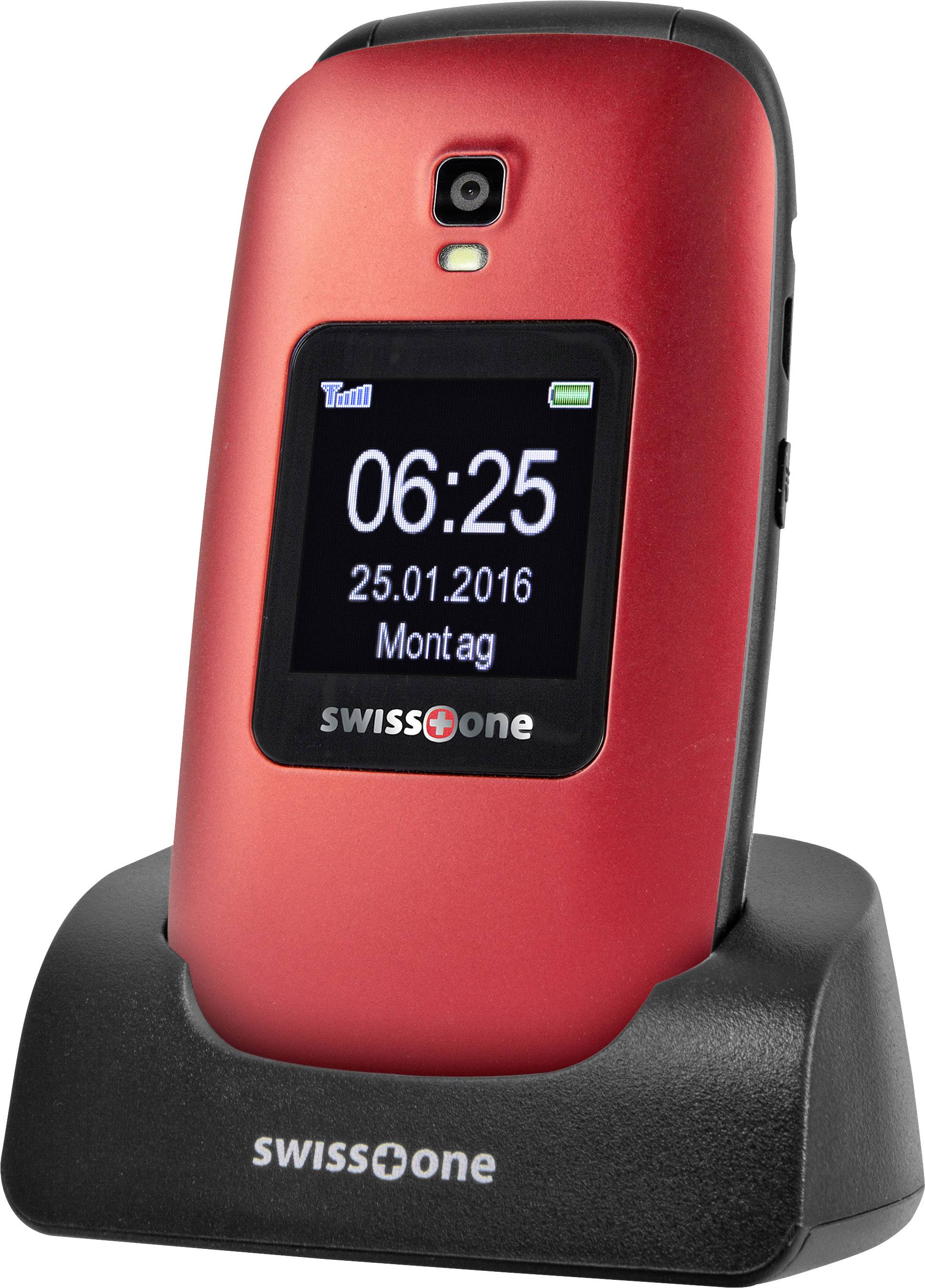 A red flip phone sits in a charging dock. The display shows '06:25 25.01.2016 Monday'. The accent colour is black.<br><br>Note: This translation uses British English spellings like "colour" and maintains the original structure and meaning of the German text.