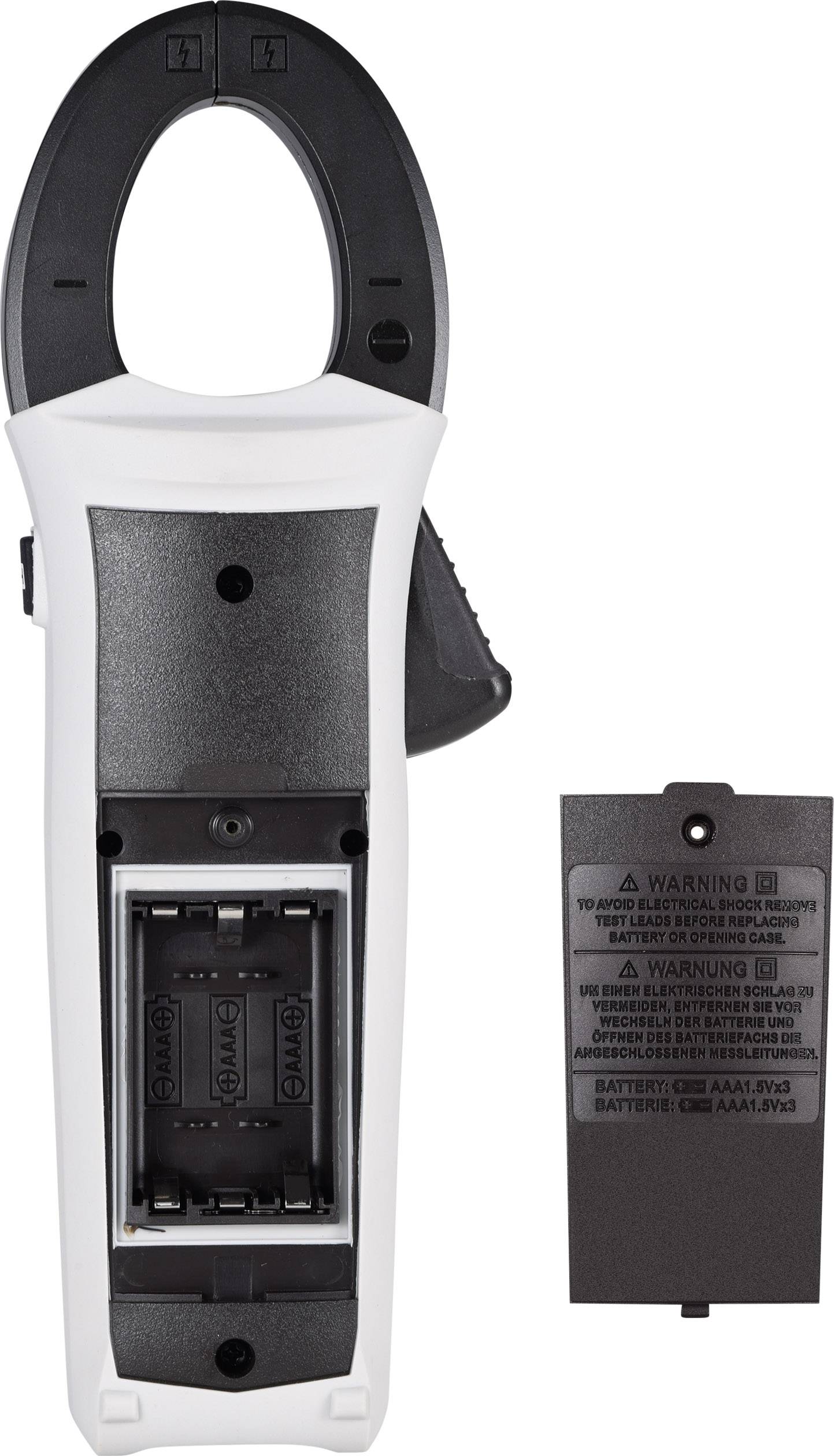 Digital multimeter in black and white, back panel open, battery compartment visible, battery cover placed beside it.