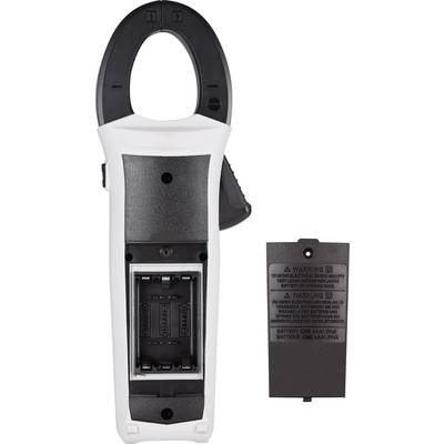 Digital multimeter in black and white, back panel open, battery compartment visible, battery cover placed beside it.