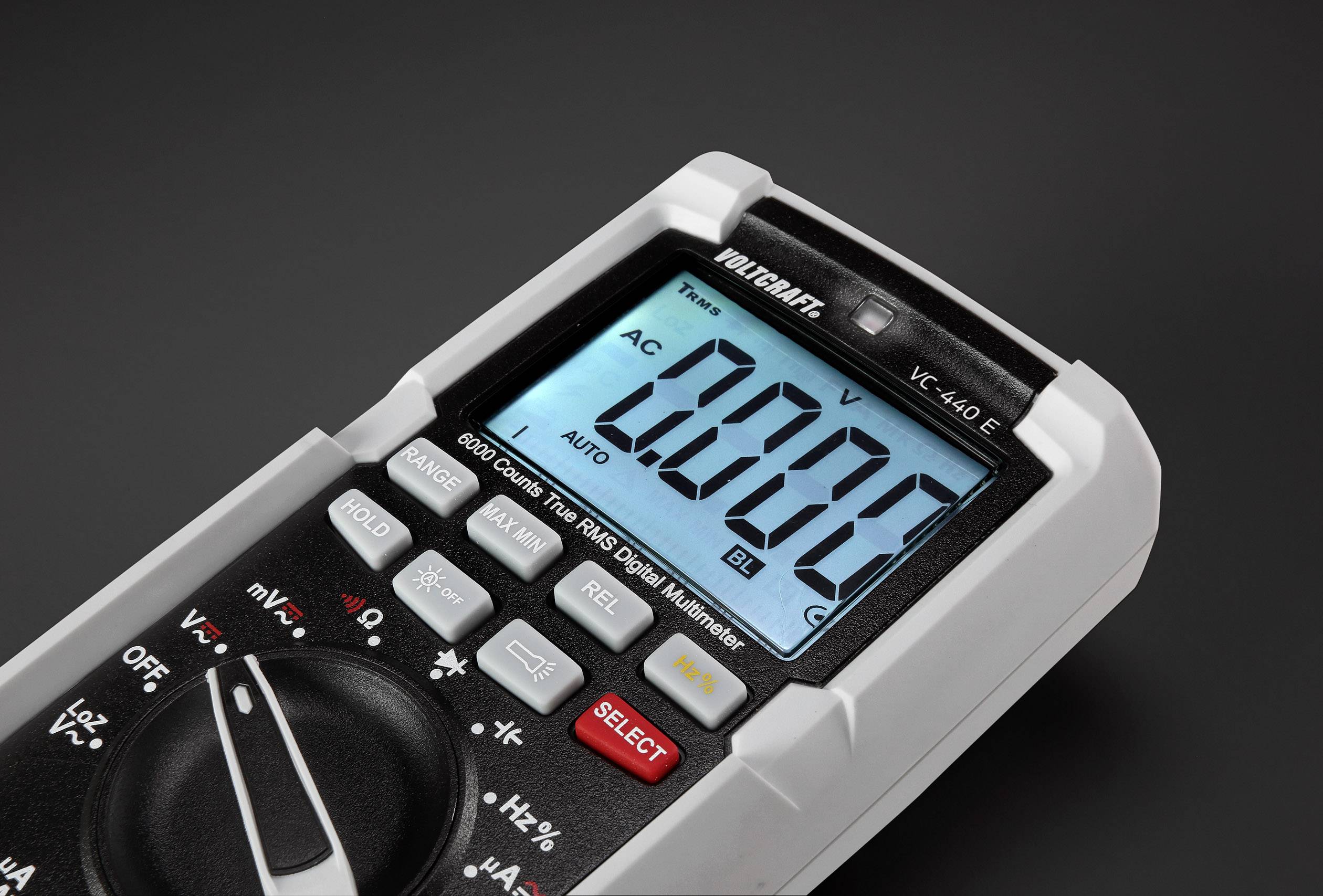 A digital multimeter displays a measured value of '200.0'. The device is set to alternating current (AC).