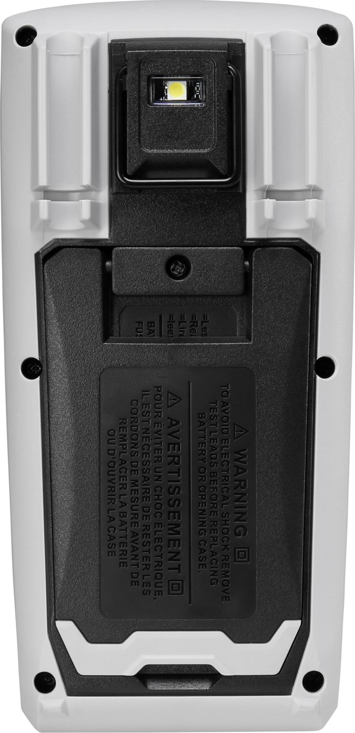 Back of an electronic device with a battery compartment and warning labels in multiple languages.