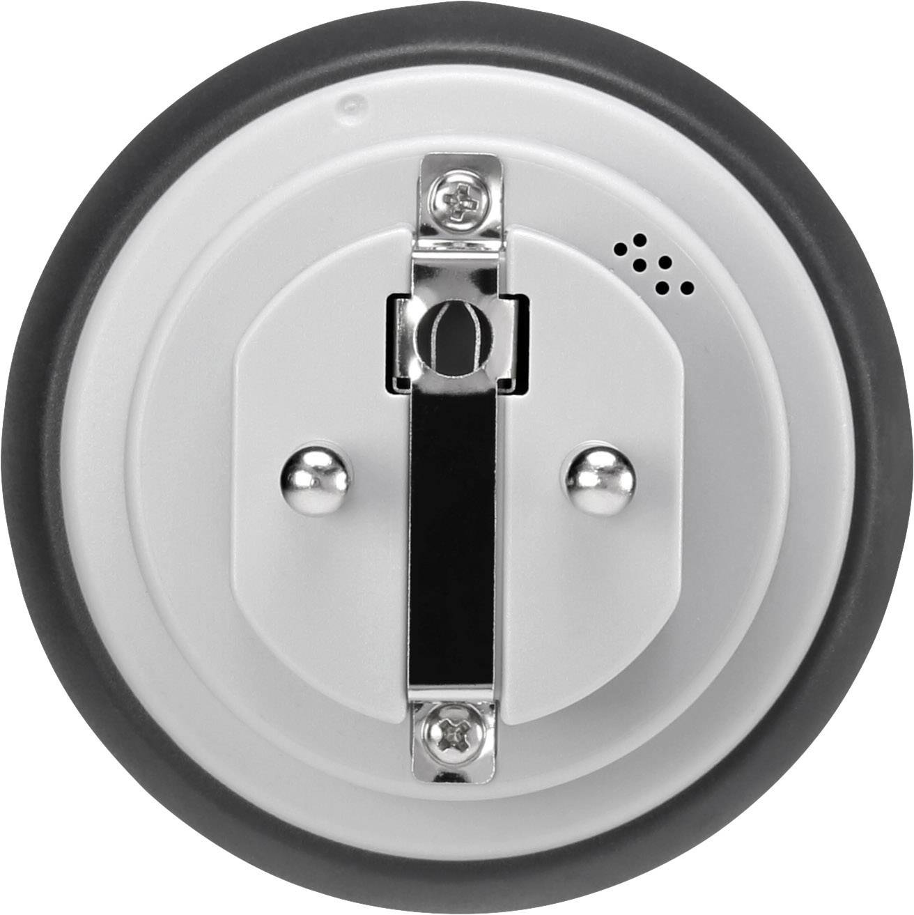 Round lid or cover with a central lever and two silver buttons. Small openings in the top right that resemble speakers.