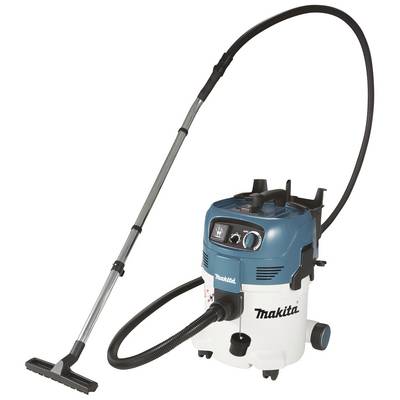 A Makita industrial vacuum cleaner with a long hose and a wide floor nozzle, suitable for workshop cleaning.
