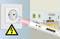 A voltage tester is held against a socket. A warning symbol indicates electrical danger. A living room is visible in the background.