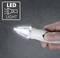 A hand is holding a small white LED torch, which is switched on. In the top left, there is a symbol with the text 'LED LIGHT'.