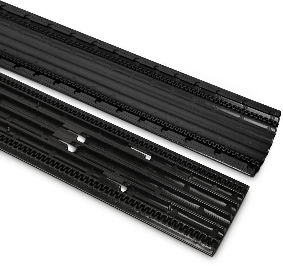 Two black plastic elements in strip form. They display different structures for modular construction or design purposes.