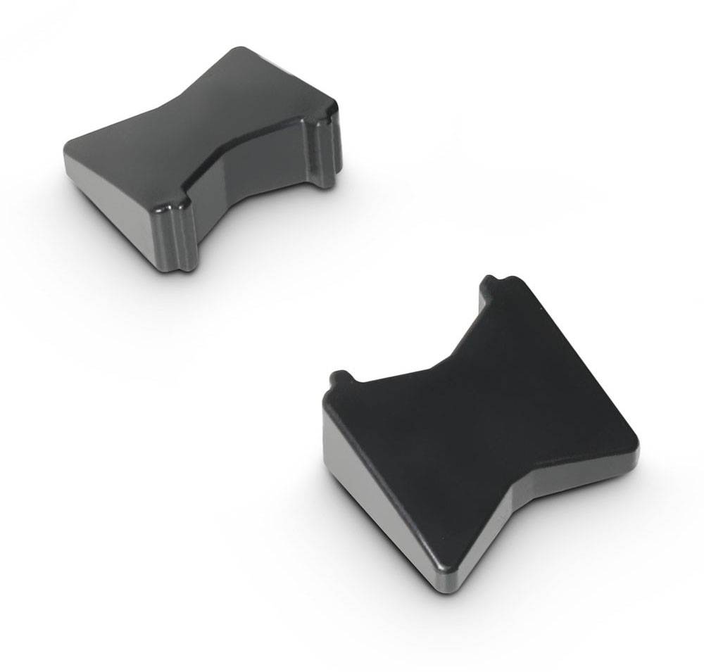 Two black plastic components with a unique shape, positioned on a white background. They appear to be designed to fit together or function as connectors.