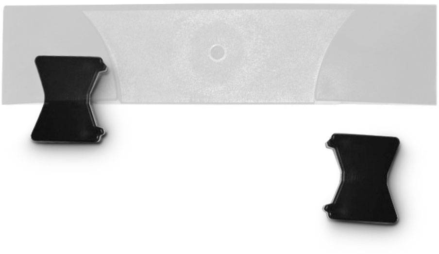 Two black clips and a transparent plastic strip lie on a white surface.