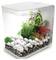 'A transparent aquarium with white stones, green plants, and a few reddish leaves, filled with water to the top, showcasing a minimalistic design.'
