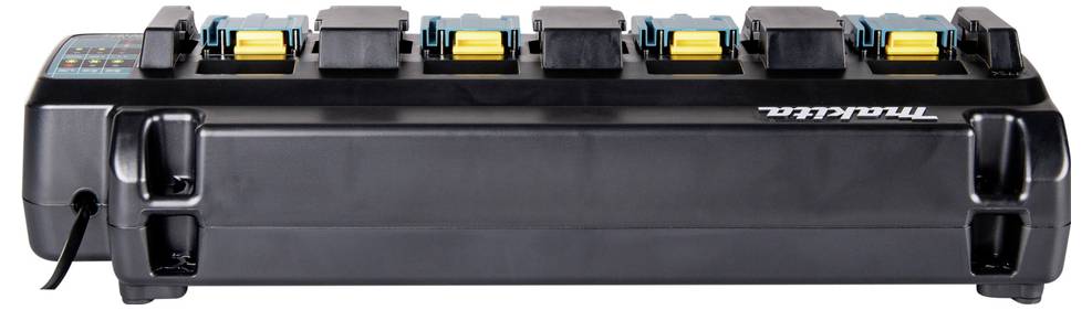 Here is the translation to British English:<br><br>'Shown is a Makita rapid charger with six charging slots for batteries. It appears to be connected to a power cable.'