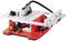 A red circular table saw with a silver table and black saw blade; suitable for cutting wood in a workshop environment.
