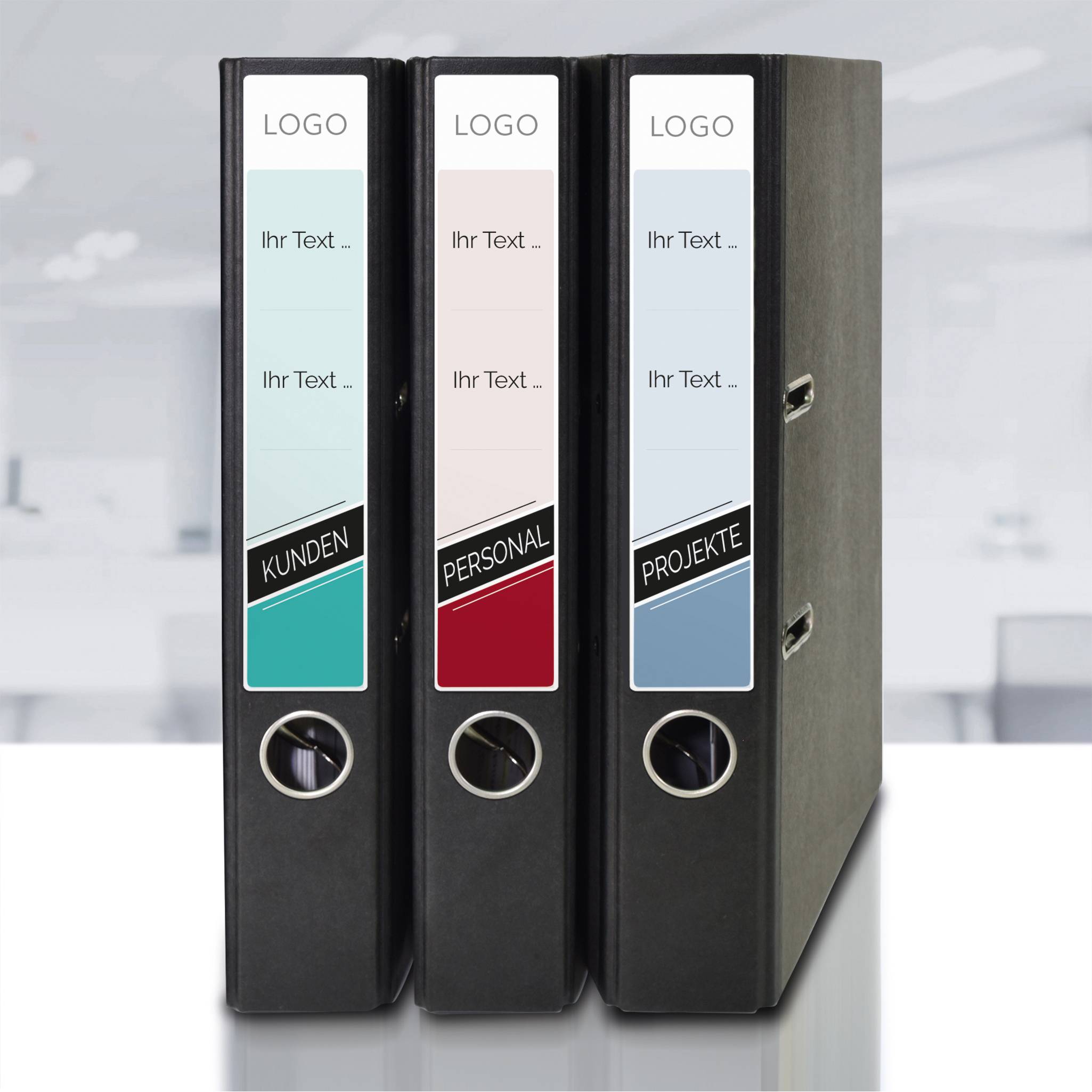 Three lever arch files with labels 'Customers', 'Staff', and 'Projects' in an office. They are placed against a blurred background.