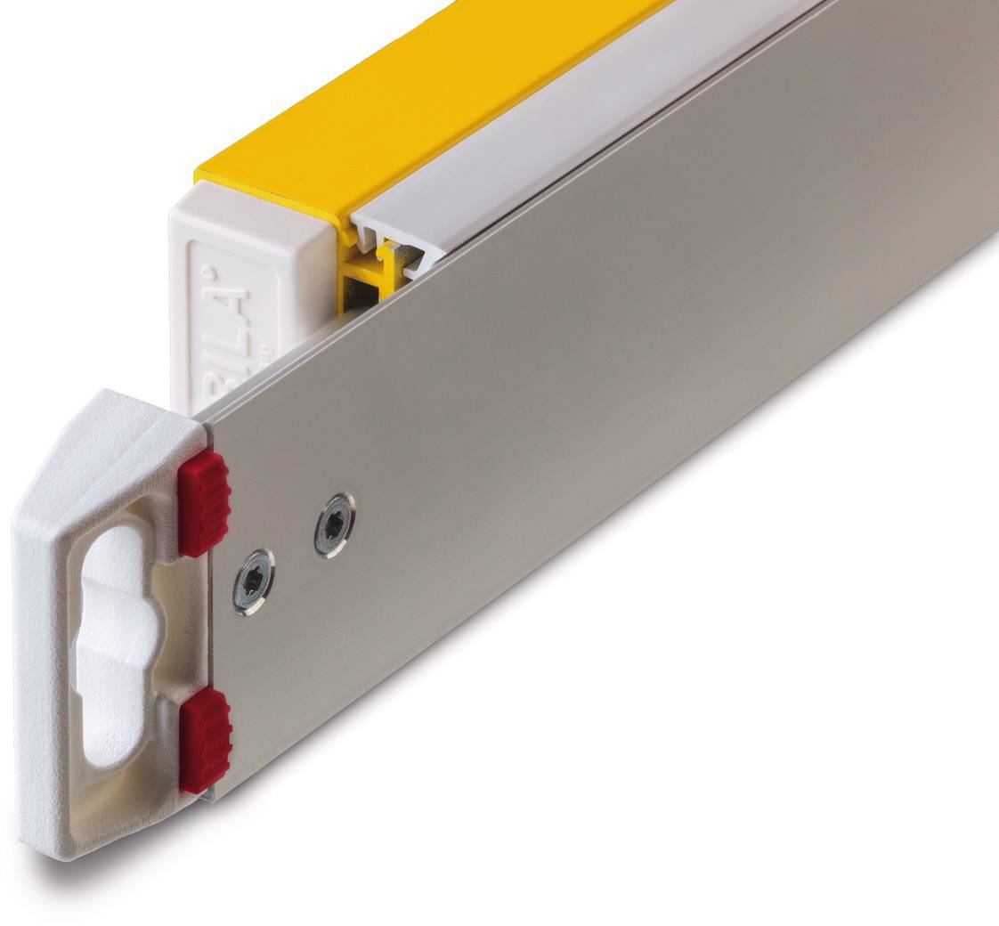 Close-up of a yellow loading gauge bearer with two red fastening elements, mounted on a silver rail.