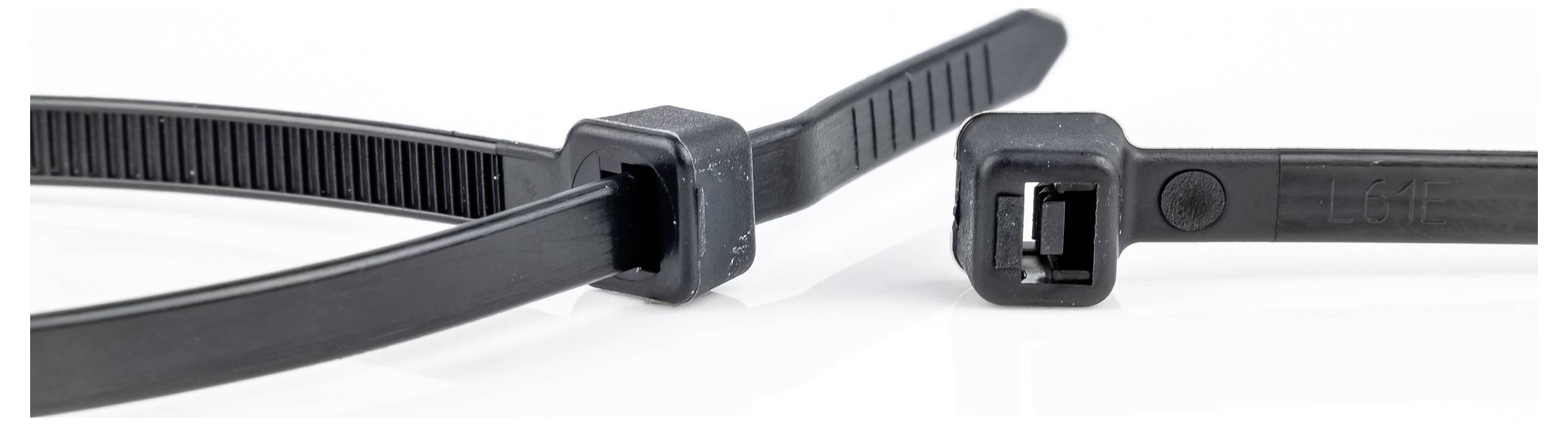 'Close-up of two black cable ties, showing the locking mechanism and ribbed surface for secure fastening.'